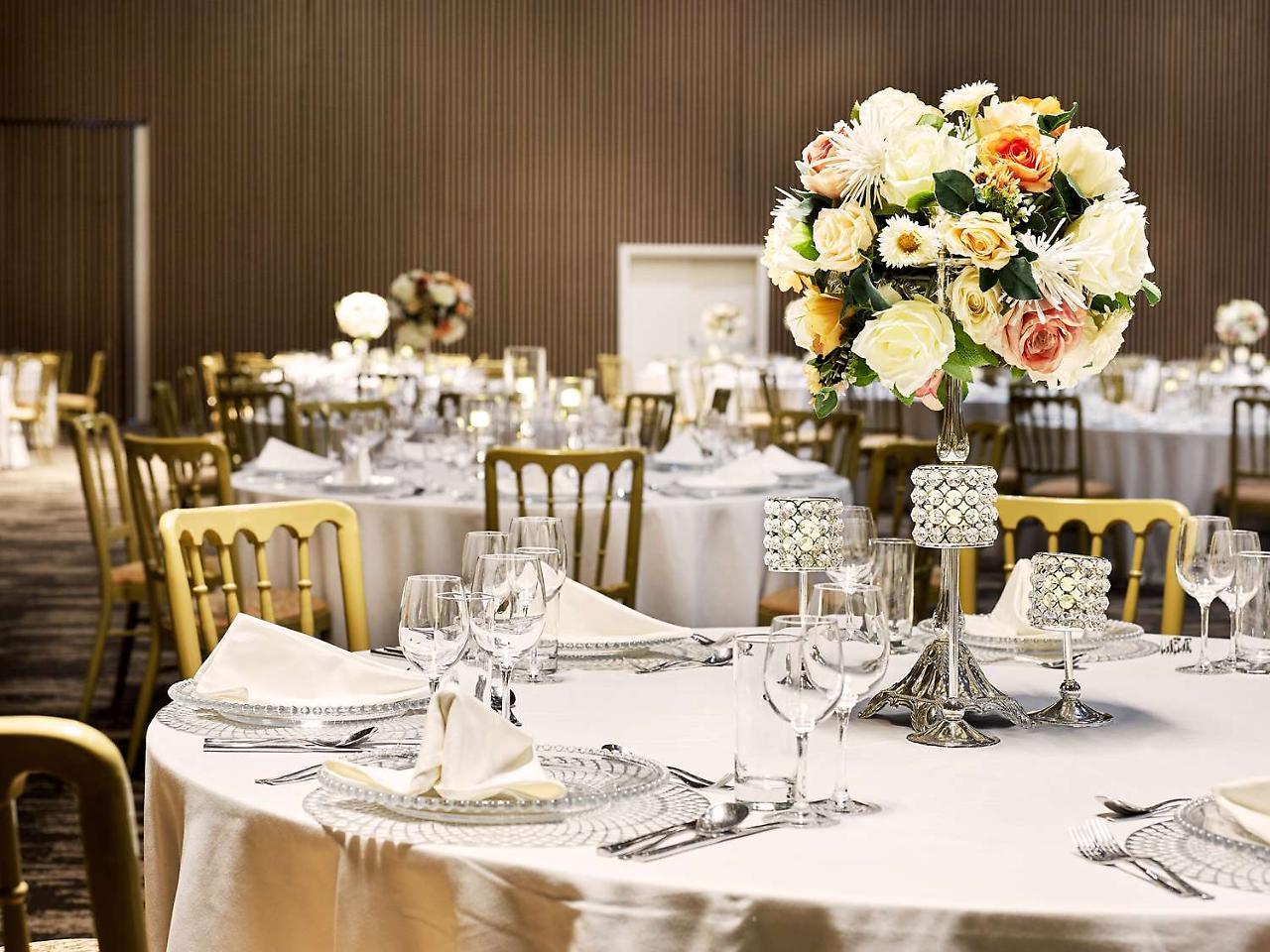 Radisson Blu Hotel & Convention Centre Kigali Dış mekan fotoğraf A table set for a formal dinner