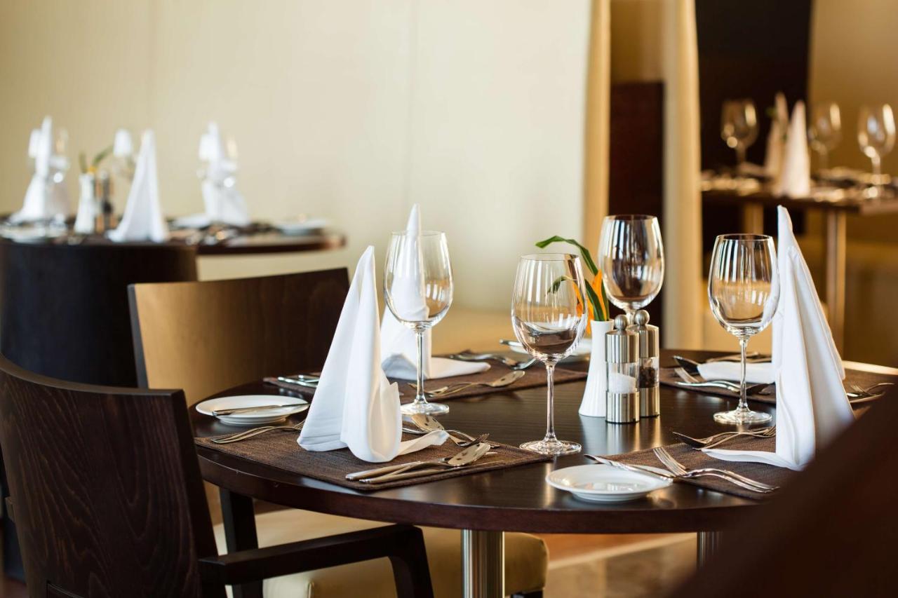 Radisson Blu Hotel & Convention Centre Kigali Dış mekan fotoğraf A table set for fine dining